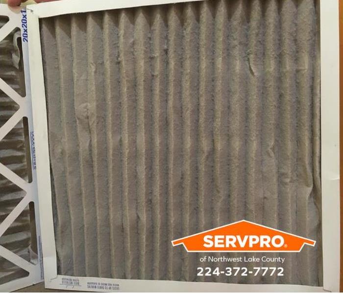 A dirty air filter in a home ventilation system is shown.