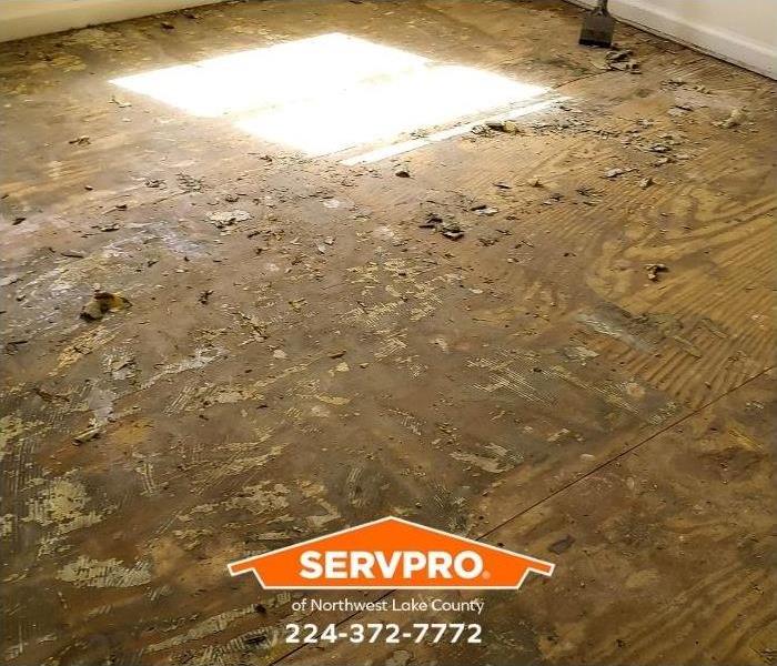 A floor with water damage is shown.